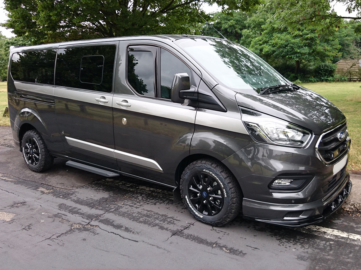 Customised Grey Ford Transit Van with Silver Stripe